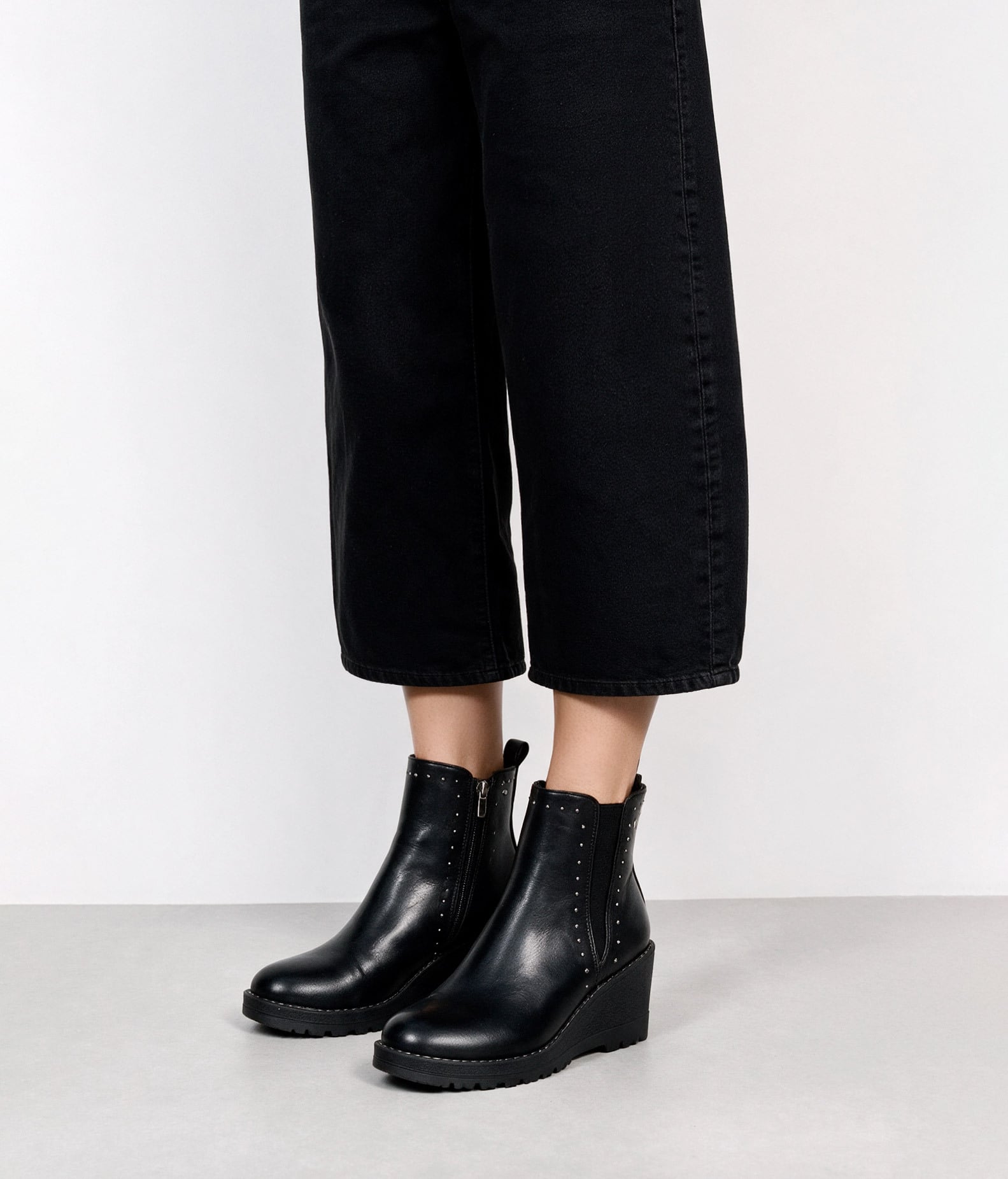 Black wedge ankle boots with studs