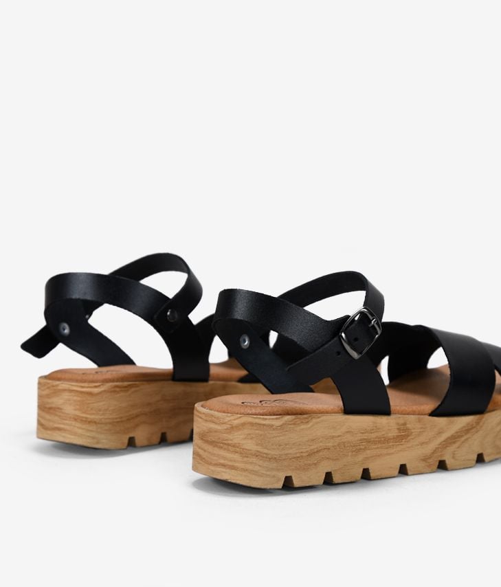 Sandalias negras en piel con plataforma de madera