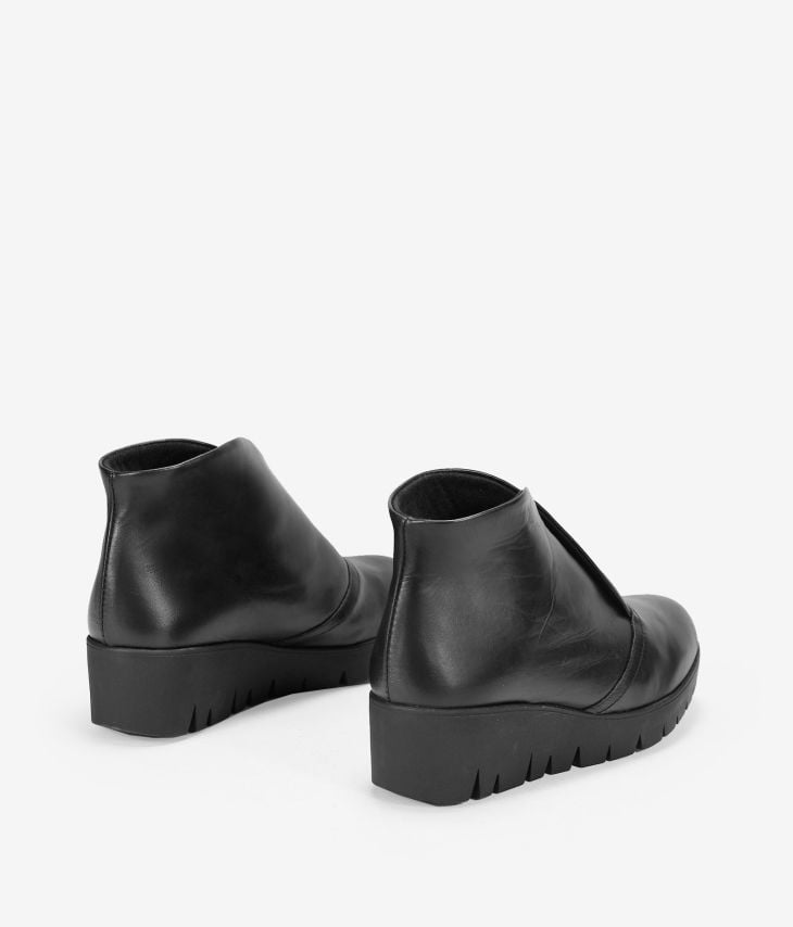 Black leather wedge ankle boots