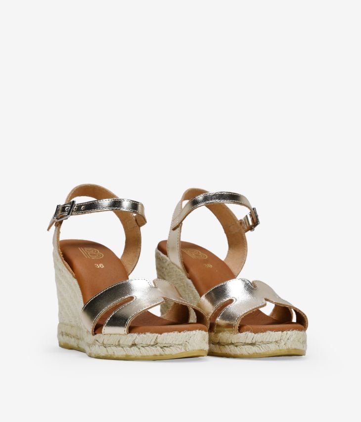 Golden leather sandals with esparto wedge