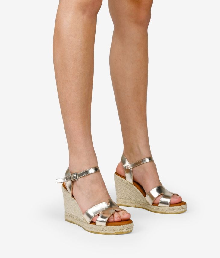 Golden leather sandals with esparto wedge