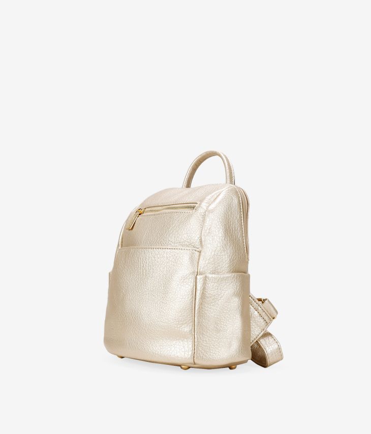 Golden backpack with zippers