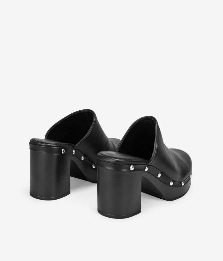 Black heeled clogs with studs
