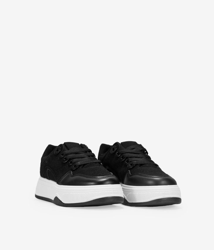 Black lace-up skate shoes