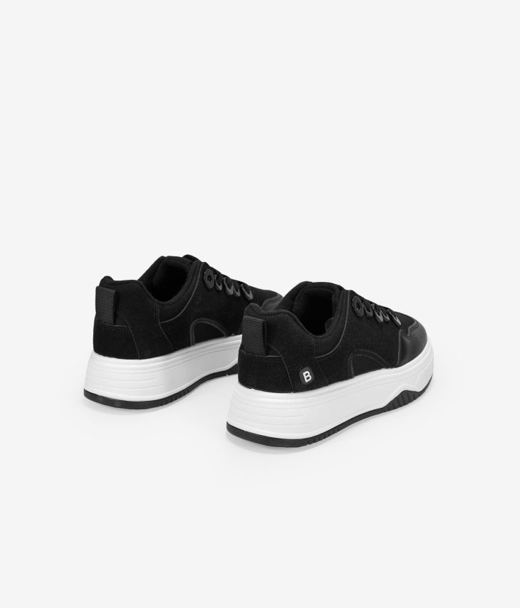 Black lace-up skate shoes