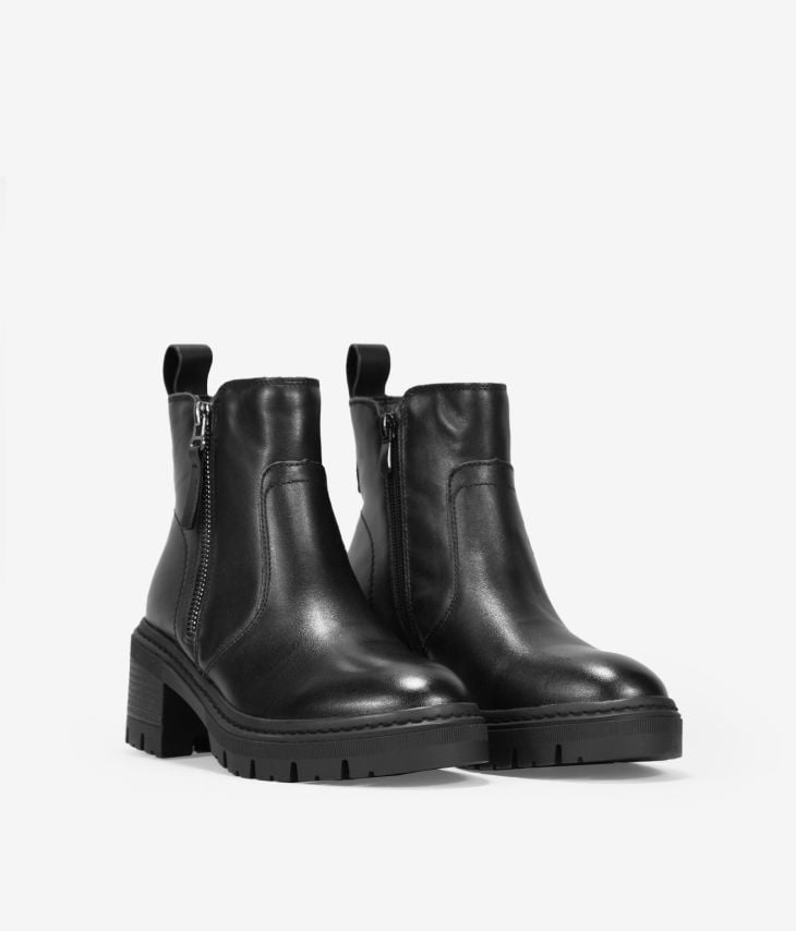 Black leather ankle boots with zippers