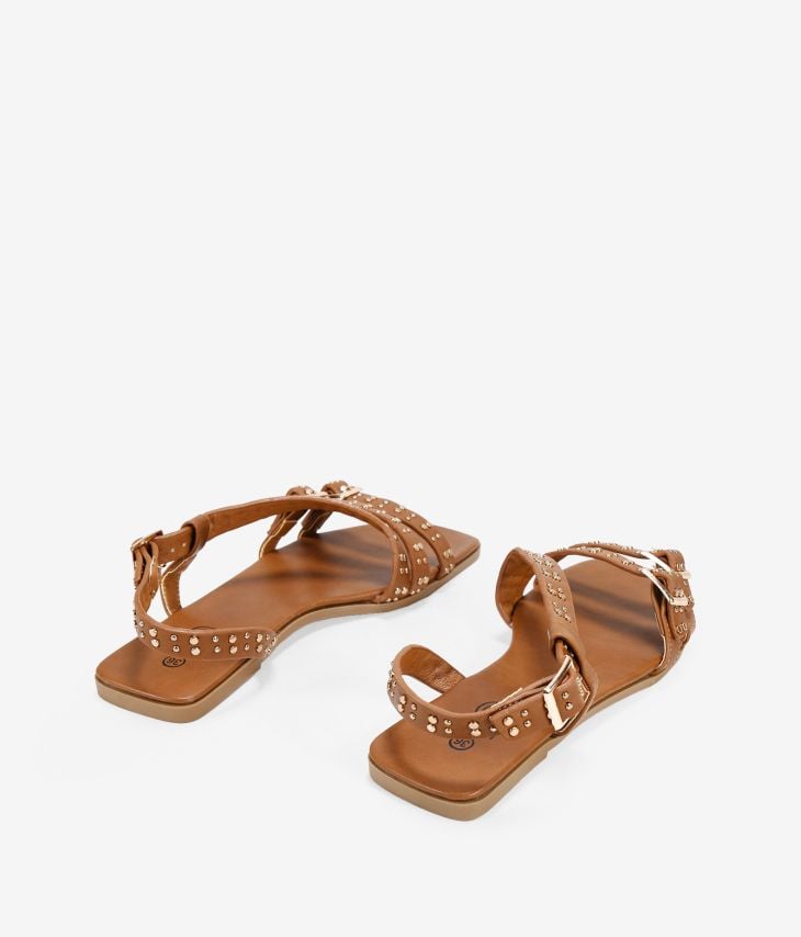 Brown flat sandals with studs and buckle