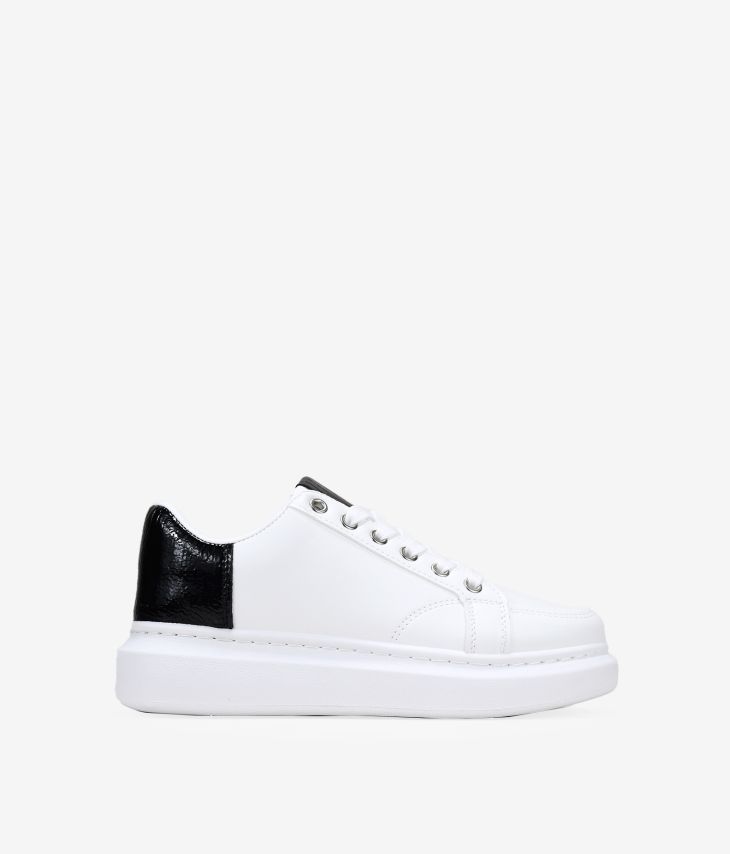White and black women's sneakers with platform