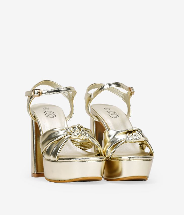 Gold heeled sandals with knot