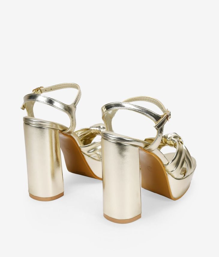 Gold heeled sandals with knot