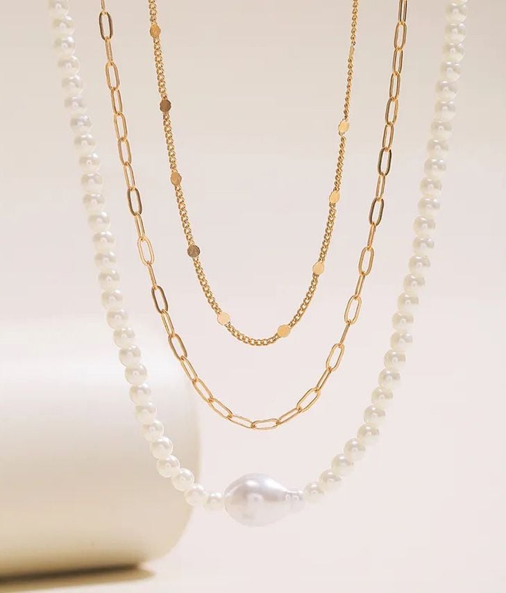 Pack of gold and pearl necklaces