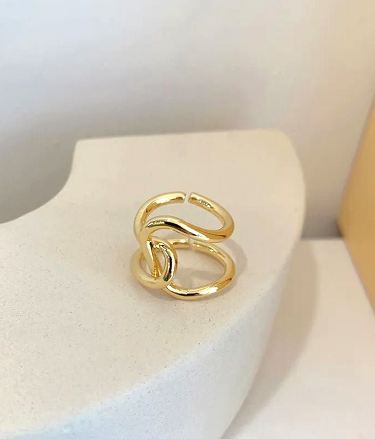 Golden metal ring with knot